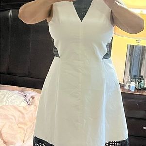 Armani Exchange Cream MIDI
Dress with black leather designs